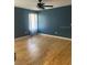 A bedroom featuring a ceiling fan and a sheer curtain at 6051 Ne 25Th Ave, Ocala, FL 34479