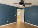 Bedroom featuring a ceiling fan and an open doorway at 6051 Ne 25Th Ave, Ocala, FL 34479