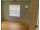 This bedroom has one window and a built-in closet at 6051 Ne 25Th Ave, Ocala, FL 34479