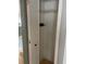 Inside closet with one shelf, with a wooden floor at 6051 Ne 25Th Ave, Ocala, FL 34479