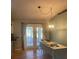 Dining room featuring french doors, a table, and pendant lighting at 6051 Ne 25Th Ave, Ocala, FL 34479