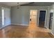 An inside view showing a front door, laundry area and open doorway, all freshly painted at 6051 Ne 25Th Ave, Ocala, FL 34479