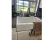 Kitchen featuring a large sink underneath a window with a view of the backyard at 6051 Ne 25Th Ave, Ocala, FL 34479