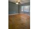 Spacious living room with ceiling fan and natural light from windows at 6051 Ne 25Th Ave, Ocala, FL 34479