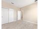 Neutral bedroom with plush carpet and closet with sliding doors at 7337 Sw 89Th Ter, Ocala, FL 34481