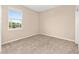 Neutral bedroom featuring plush carpeting and a window providing ample natural light at 7337 Sw 89Th Ter, Ocala, FL 34481