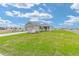 Exterior view of a home with a two-car garage and concrete driveway at 7337 Sw 89Th Ter, Ocala, FL 34481