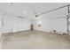 Spacious two car garage with white walls, concrete floor, and an insulated garage door at 7337 Sw 89Th Ter, Ocala, FL 34481