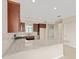 Open kitchen boasts dark wood cabinets, stainless appliances, granite counters, and recessed lighting at 7337 Sw 89Th Ter, Ocala, FL 34481