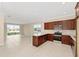 Modern kitchen with stainless steel appliances, granite countertops, and ample cabinet space at 7337 Sw 89Th Ter, Ocala, FL 34481