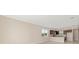 Spacious living area featuring tile floors and a view of the kitchen area at 7337 Sw 89Th Ter, Ocala, FL 34481