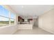 Bright living space showcasing an open floor plan with a view of the kitchen at 7337 Sw 89Th Ter, Ocala, FL 34481
