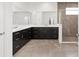 A luxurious bathroom with dual vanities, a large mirror, and a tiled walk-in shower at 7624 Sw 60Th St, Ocala, FL 34474
