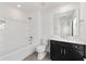 Modern bathroom features a shower-tub combination and sleek vanity at 7624 Sw 60Th St, Ocala, FL 34474