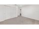 Minimalist bedroom with a closet, carpet, and white walls at 7624 Sw 60Th St, Ocala, FL 34474