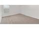 Cozy bedroom with neutral carpet, a window, and a closet at 7624 Sw 60Th St, Ocala, FL 34474