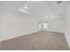 Primary bedroom featuring neutral carpet, white walls, and a tray ceiling at 7624 Sw 60Th St, Ocala, FL 34474