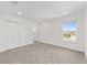 Bright bedroom with carpet, closet, and white walls at 7624 Sw 60Th St, Ocala, FL 34474