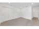 Simple bedroom with neutral carpet, a closet, and white walls at 7624 Sw 60Th St, Ocala, FL 34474