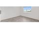 A dining room featuring neutral tile flooring, white walls, and a window with a view of the backyard at 7624 Sw 60Th St, Ocala, FL 34474