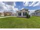 Attractive two-story home features a well-maintained lawn, a side view perspective, and a functional three-car garage at 7624 Sw 60Th St, Ocala, FL 34474