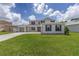 Beautiful two-story home showcases a manicured lawn, ample parking, and a functional three-car garage at 7624 Sw 60Th St, Ocala, FL 34474