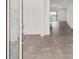 Inviting foyer showcasing tile flooring, an open floor plan, and access to a staircase for a seamless transition at 7624 Sw 60Th St, Ocala, FL 34474