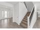 Foyer with tile floors, a staircase, and a front door with glass panels at 7624 Sw 60Th St, Ocala, FL 34474