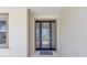 Elegant front door with decorative glass panels, enhancing the entrance with natural light and sophisticated charm at 7624 Sw 60Th St, Ocala, FL 34474