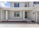 Welcoming front porch featuring classic columns, a stylish front door, and neat landscaping for a great first impression at 7624 Sw 60Th St, Ocala, FL 34474