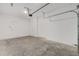 Clean and spacious garage with ample room for vehicles and storage, featuring a bright white door at 7624 Sw 60Th St, Ocala, FL 34474