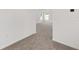 Hallway with neutral carpet, white walls, and doorways leading to other rooms at 7624 Sw 60Th St, Ocala, FL 34474
