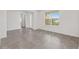 Bright living room featuring tiled flooring, a front entrance view, and an open layout for comfortable living at 7624 Sw 60Th St, Ocala, FL 34474