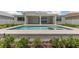 Stylish in-ground pool with spa and patio, surrounded by lush landscaping at 7624 Sw 60Th St, Ocala, FL 34474