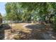 Large backyard with mature trees and wood and vinyl fencing at 8053 Sw 62Nd Ave, Ocala, FL 34476