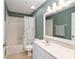 Traditional bathroom with white vanity, toilet, and shower/tub combo at 8053 Sw 62Nd Ave, Ocala, FL 34476