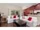 Comfortable living room with hardwood floors, sliding doors to patio, and bar seating at 8053 Sw 62Nd Ave, Ocala, FL 34476