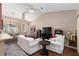 Cozy living room featuring hardwood floors, comfortable seating, and ample natural light creating a warm atmosphere at 8053 Sw 62Nd Ave, Ocala, FL 34476