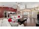 Inviting open-concept living room with hardwood floors and seamless flow to the kitchen at 8053 Sw 62Nd Ave, Ocala, FL 34476
