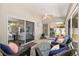 Inviting sunroom with comfortable seating and views of the well-maintained backyard at 8053 Sw 62Nd Ave, Ocala, FL 34476