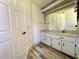 Bright bathroom with updated vanity and laminate flooring at 8239 Sw 108Th St, Ocala, FL 34481
