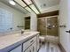 Bathroom with a vanity and tub and shower combo with sliding doors at 8239 Sw 108Th St, Ocala, FL 34481