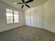 Bright bedroom with a ceiling fan and double closets at 8239 Sw 108Th St, Ocala, FL 34481