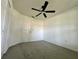 Bright bedroom features neutral carpet, ceiling fan, and a closet at 8239 Sw 108Th St, Ocala, FL 34481