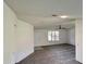 Cozy living room featuring carpet, tile entry, neutral walls and a front door at 8239 Sw 108Th St, Ocala, FL 34481
