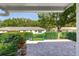 Back patio with brick pavers, view of fenced-in yard and mature trees at 9661 Sw 95Th Ct # B, Ocala, FL 34481