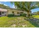 Backyard featuring well-maintained landscaping, mature trees, and partially fenced-in area at 9661 Sw 95Th Ct # B, Ocala, FL 34481