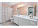 Bathroom with long vanity and lots of cabinets, tub/shower and nice neutral flooring at 9661 Sw 95Th Ct # B, Ocala, FL 34481
