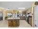 Well-equipped kitchen featuring an island and stainless steel appliances at 9661 Sw 95Th Ct # B, Ocala, FL 34481