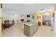 Bright open-concept kitchen with granite island and stainless appliances at 9661 Sw 95Th Ct # B, Ocala, FL 34481